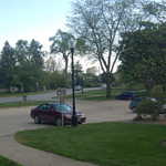 DSC_0028.JPG
Continuation to the right, showing a view of the same parking lot as previous image, and surrounding area at Sixth Avenue, in front of Mears Cottage. In the right of the photo, if you look closely, you can see some of the railroad that runs through the Grinnell Campus and crosses Sixth Avenue. 