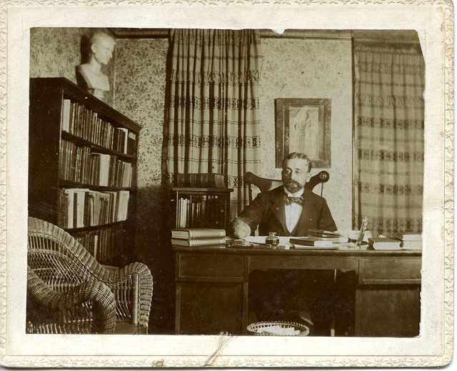 Pictured here is Professor MS Slaughter, presumably in his office at Grinnell College. 
Notice how this photograph appears to be a more candid shot of Slaughter. His hand appears to be moving and he is not posing for the camera (perhaps the photo was staged this way). Notice also the classical bust (not sure of whom) atop his bookshelf to the left of the photograph. Such seems appropriate for a man dedicated to the Greek and Roman Classics.
FmChrisJones}GrinLibArchive=52 psl1 Moses S. Slaughter - Grinnel.jpg
