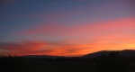 Sunset Overlooking the Next Town. Like the ZMM Narrator, I Feel the Loneliness and Letdown At the End of the Day.   No matter where I am, every evening on my ZMM Research Trip I stop to participate in the peaceful scenes at sunset, and as the Narrator emphasizes work on "peace of mind". At each sunset, I take the time to photograph the view. Someday I will place these photos in a special album, or should I add them into the real time sequence of my album "Flowers and Red Wing Blackbirds Along the ZMM Route"?  Several miles Northeast of Cambridge, ID.  ************************************  (Photo = 111-1157c ...... ZMM Page = 261 ...... WayPt = 292`|w|' ~3400ft) 

