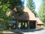Agriculture Inspection Station When Entering California from Oregon.  To make this building, in the middle of nowhere, the highway department used local timber. But they had to use giant redwood logs to form the support structure, because of the absence of sawmills. I took the time to photograph these logs visible inside this building.  Route 199 at Oregon-California Border.      115-1518_IMG.JPG