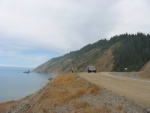 A View North Along The Pacific Ocean Coast From the Road High On a Steep Cliff. The Road From Leggett Comes Out of the Notch In the Higher Cliffside At Right.    1.5 mi North of Rockport, CA.  (Photo = 116-1687.JPG )