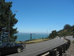 I Risked My Neck To Run From My (Right Berm) Parked Car, To the Median to Get This Photo. I had to Wait Quite a While To Get this Open Space in the Heavy Traffic.  I Got Honked At As I Ran Back To Safety. But Worth It Since How Else To Get a Dramatic Photo!  I believe that is San Quentin Island and  the San Francisco Bay Bridge in the distance. You Will see the Golden Gte Bridge Ahead.  Marin City, CA.  (Photo = 118-1807.JPG )