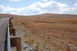 Awesome Views in the Narrator's High Country! These Mountain Tops Show Mostly Dead Grass In September!  On my re-traveling this highway in 2006, I got my 8 photo 360 Degree Panorama shots messed in 2002. These  will be posted to my ZMM Part II Gallery as soon as possible.   Above the tree line, Bearttooth Pass, MT.  ************************************  (Photo = Summer2006 0034 ...... ZMM Page = 110 ...... WayPt =~136k) 


