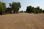 Despite the Bad Lands We Just Saw, Here Survives a Small Town.  On my second trip to Miles City and Bozeman, I had more time so I decided to stop, rest and take this photo In the Center of this small town. Here on this business area on a side street off Rt 12, the town doesn't seem so abandoned and desolate as the main road thru town. It even has an active railroad.  Marmarth, MT.  ************************************  (Photo = Summer 2006 0355...... ZMM Page = 071 ...... WayPt = 079 `|w|' ft)