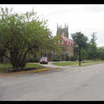  The University of the South. Sewanee, Tennessee. 
This central campus view opens looking east. As you scroll around you will see the distant high gothic steeple of an Episcopal Cathedral.  Mid-panorama, note the long colonnade covered walkway. This leads to the red roofed building which holds classrooms and professor's offices. Looking over the red roof of the Classroom Building, you can make out a second Gothic Tower. The Cathedral is shown in the next panorama.   University of the South, Sewanee, TN.************************************ (Photo = 129-2965+7 ...... ZMM Page = None ...... WayPt = 534 1890ft)