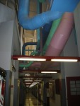 Another View of the Science Building Ducts and Pipes Over the Hallway.   At upper left the stairway handrail to the top level can be discerned.  Science Building,  USCA Campus, Aiken, SC.  ************************************  (Photo = 4999 ...... WayPt = `000 |w|' 420 ft)