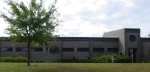 North Side of Our Science Building.  As you may deduce, by contrast with the previous photo, this three-story science building is built into a hillside, with it's North face mostly earth embanked! These earth embanked building sides, are thus shielded from the cold winter winds which come mostly from the Northwest in the Aiken area. As is the case for our USCA Science Building, I was similarly involved with the planning of the first phase of the Ruth Patrick Science Education Center Building (RPSEC), where a number Energy Conserving Features were incorporated, as well as Architecturally Integrated Science Demonstrations. Science Building, USCA Campus, Aiken, SC.  ************************************  (Photo = 5000m ...... WayPt = `000 |w|' 420 ft)