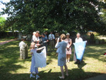My Daughter Elisabeth Is taking Photos of the Family After the Baptism. My Granddaughter Brooke, Is Holding Up Baptism Banner Given to Mathew earlier by the Church. Further back, Stanley Price with Matthew Price, Stanley's Mother Norma  Price, Tommy Brown, Brent Price, Stephanie and friend (not facing camera), my Daughter Margaret Gurr Davis and my wife Suzanne Engle Gurr. Photo = 4785.