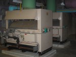Two Gas Fired Boilers For General Building Heat.  In winter these "boilers" heat water which is circulated throughout the building. The hot water is subsequently converted to warm air at individual heat exchangers in each room or lab. The air is moved thru these heat exchangers by a local axial flow fan, which is in turn controlled by a thermostat in that room. As summer approaches the hot water system is changed over to the refrigerator units to make it a chilled water system. This system, working in much the same way, then cools the individual rooms and labs.  HVAC Equipment Room, Basement of Science Building, USCA Campus, Aiken, SC.  ************************************  (Photo = 5139 ...... WayPt = `000 |w|' 420 ft)