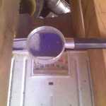 Designing (& Testing) A Solar Regenerated Desiccant Air Conditioner for our Passively Heated Solar Home, by Henry Gurr. This is the fifth of a series of nine photos. Please see the first in this series (pix 16/76) for full explanation. 

Shown here is an even closer view of the bathroom scales supporting the weight of the inclined collector. This view is showing how I would read the numbers on bathroom scales, through the  magnifying glass in center of photo. 

This is how I determined how much weight of water the wood shavings would gain, or lose, weight of humidity (water).



Photo_080811_005.jpg